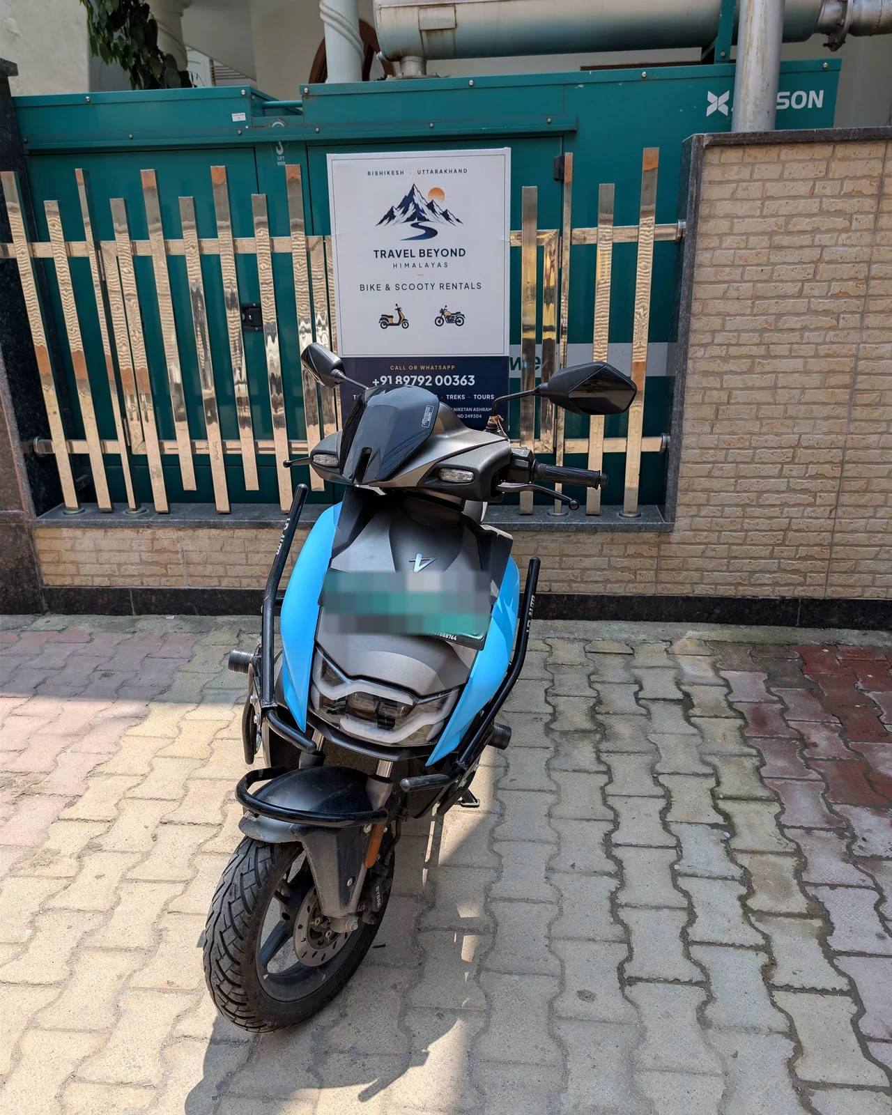 Front view of the blue electric scooter available for rent in Rishikesh