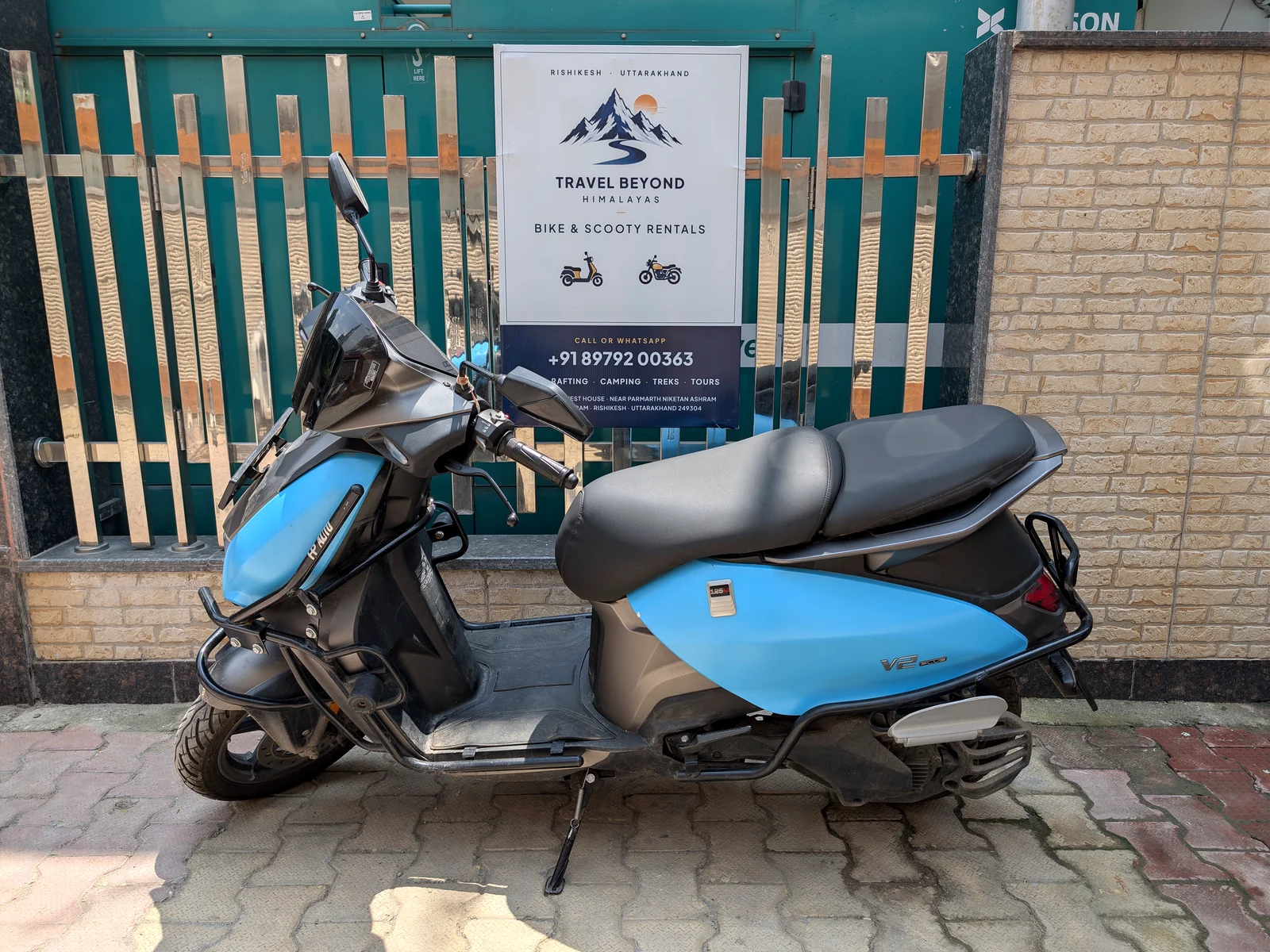 Side view of the blue electric scooter available for rent in Rishikesh