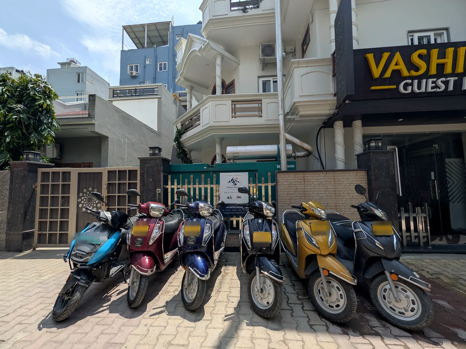 Travel Beyond Himalayas rental scooters lined up outside the Rishikesh office
