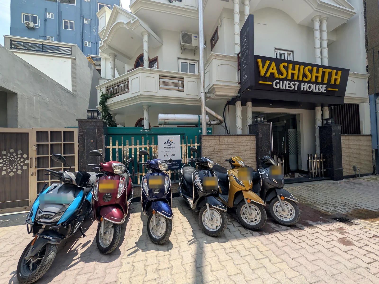 Travel Beyond Himalayas scooter rental fleet outside the Swarg Ashram office in Rishikesh